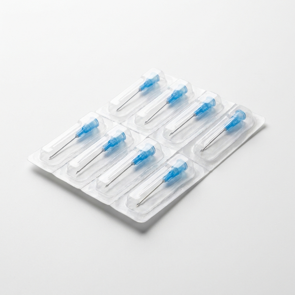 Sterile 23G hypodermic needles with blue luer-lock hubs in blister packs
