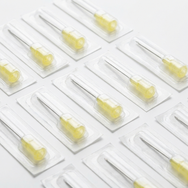 Sterile 30G hypodermic needles with yellow luer-lock hubs in blister packs